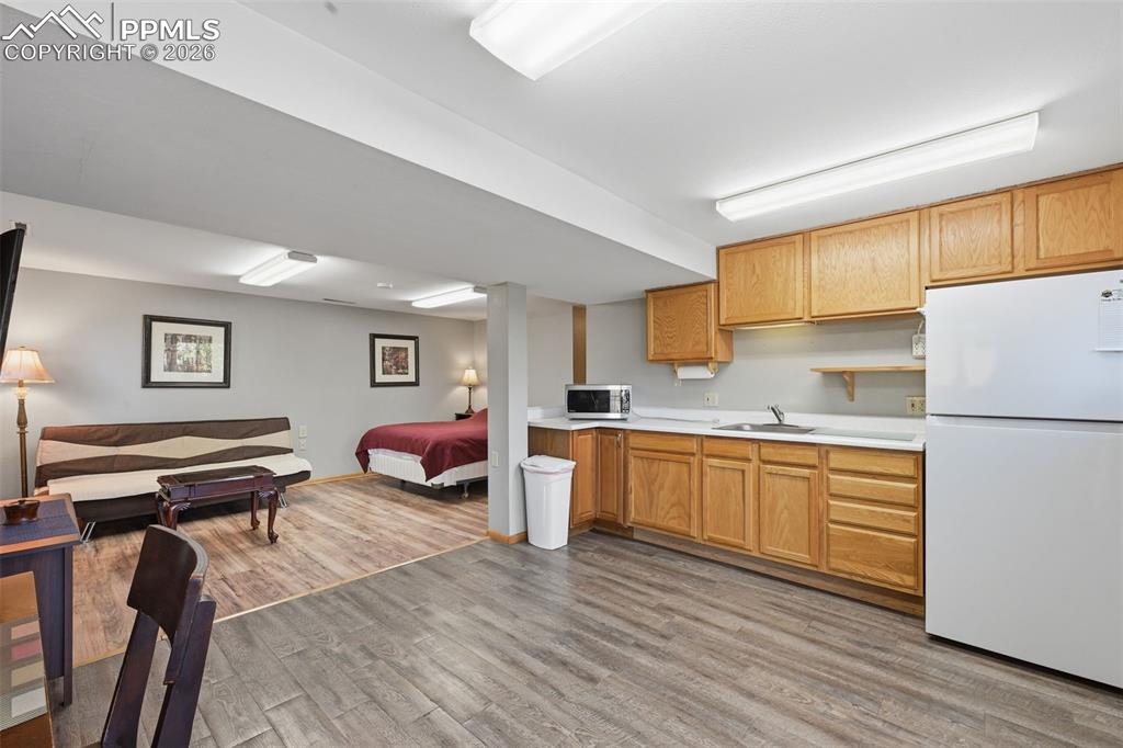 Image 43 of 49: The Kitchenette in the Basement Apartment is spacious and is set up like yo