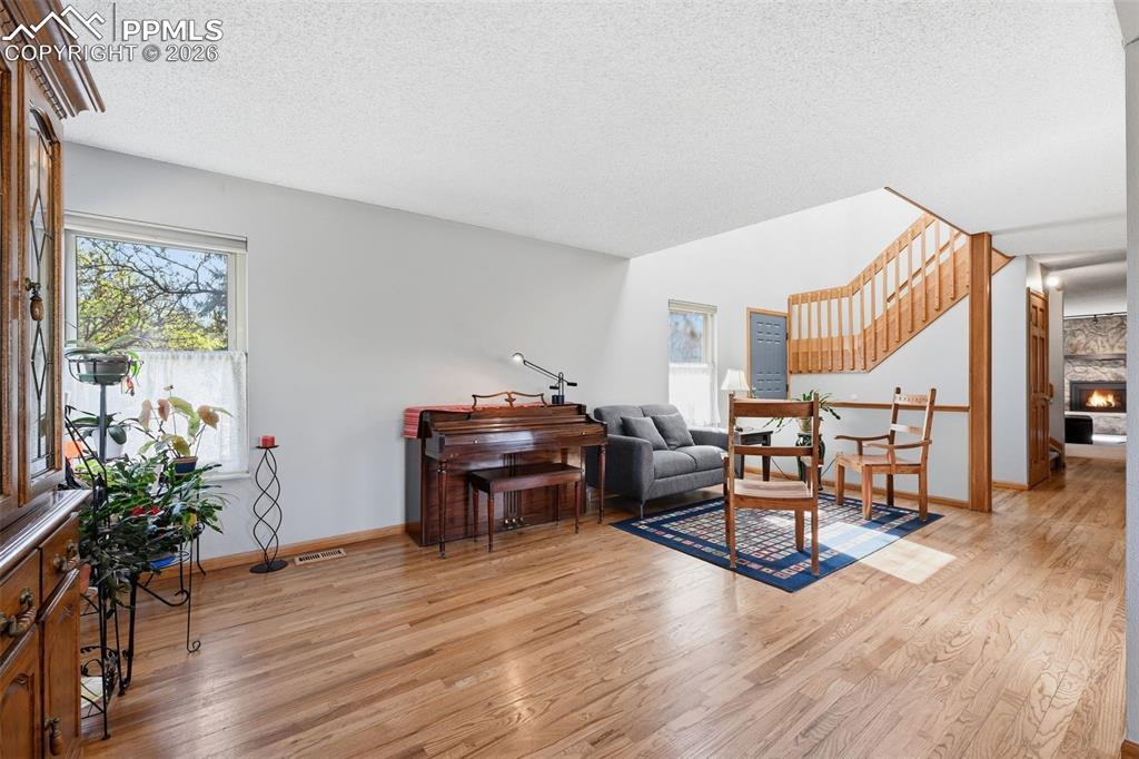 Image 5 of 49: Entry way and living room with great hardwood floors. 