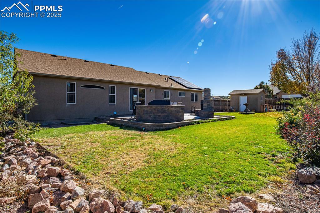 Image 32 of 35: Fully landscaped yard and thoughtful upgrades make this home move-in ready