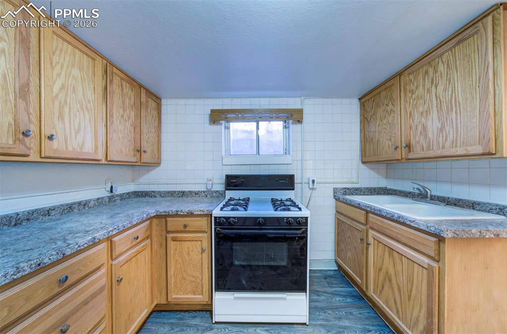 Image 17 of 23: basement kitchen