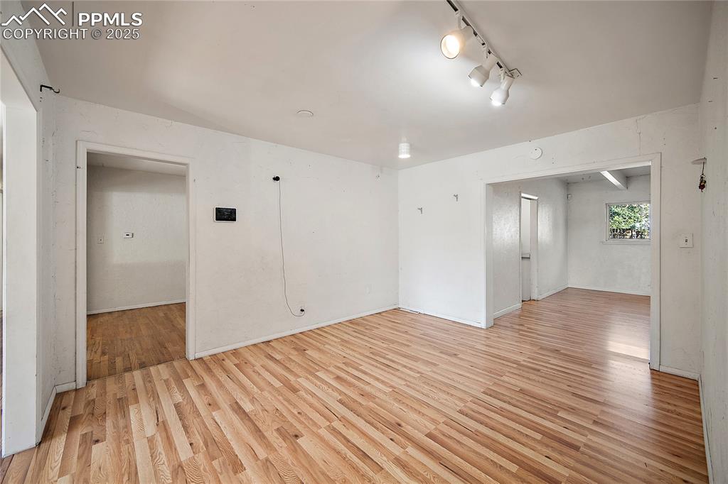 Image 10 of 31: secondary dining or living area opening up to formal dining area and family