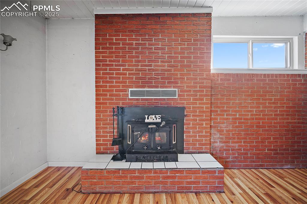 Image 13 of 31: Detailed view of fire place, and brick wall