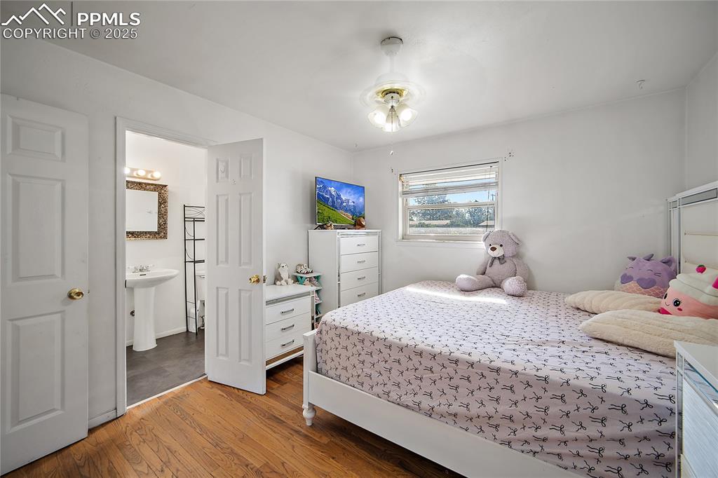 Image 17 of 31: Bedroom with light wood-type flooring