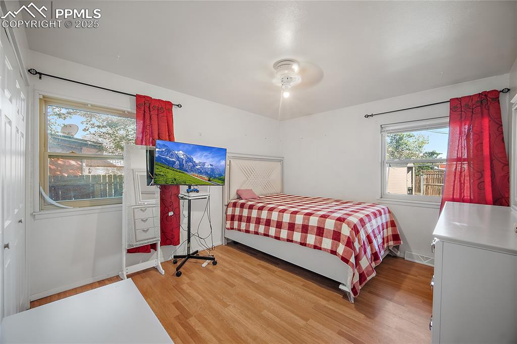Image 21 of 31: Bedroom featuring light wood-style flooring and ceiling fan