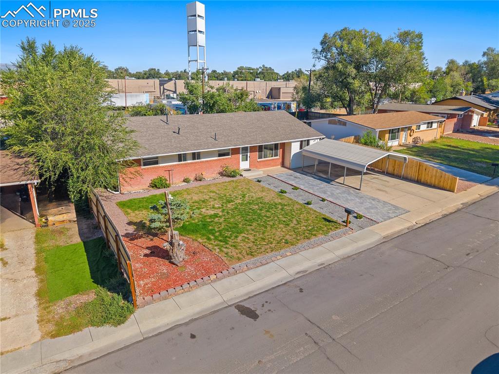 Image 26 of 31: View of front of house featuring brick siding, a residential view, concrete