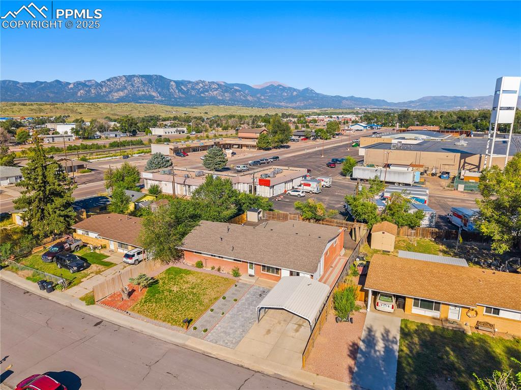 Image 28 of 31: Aerial perspective of suburban area featuring mountains