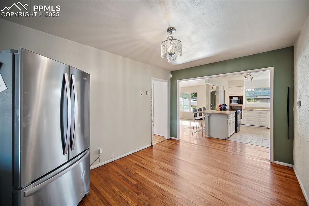 Image 7 of 31: dining room with view of the kitchen 