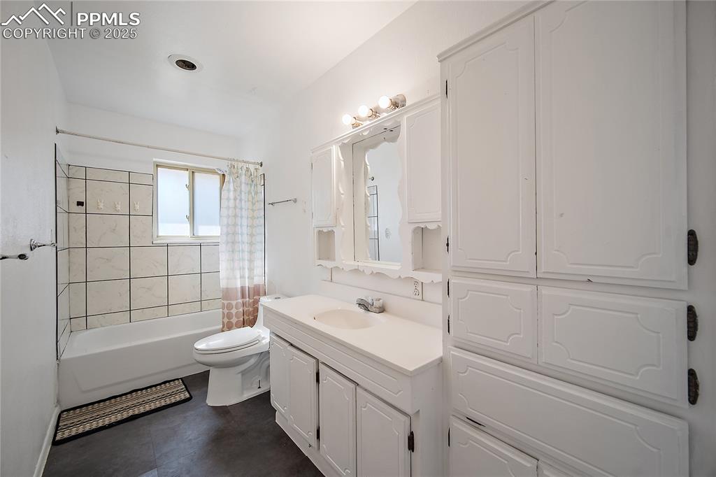 Image 8 of 31: Full bathroom featuring vanity and shower / tub combo