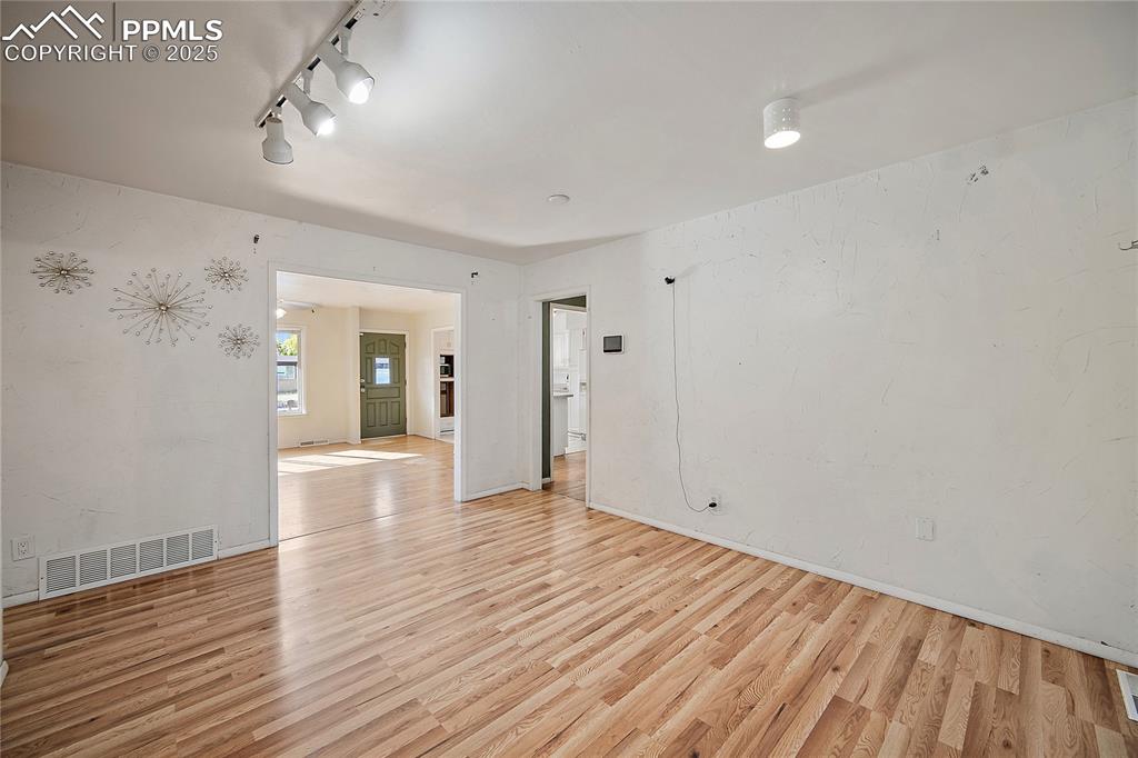 Image 9 of 31: Unfurnished room featuring light wood finished floors and baseboards