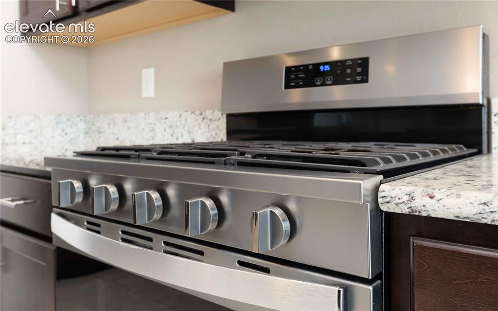 Image 13 of 40: One year old gas range/oven