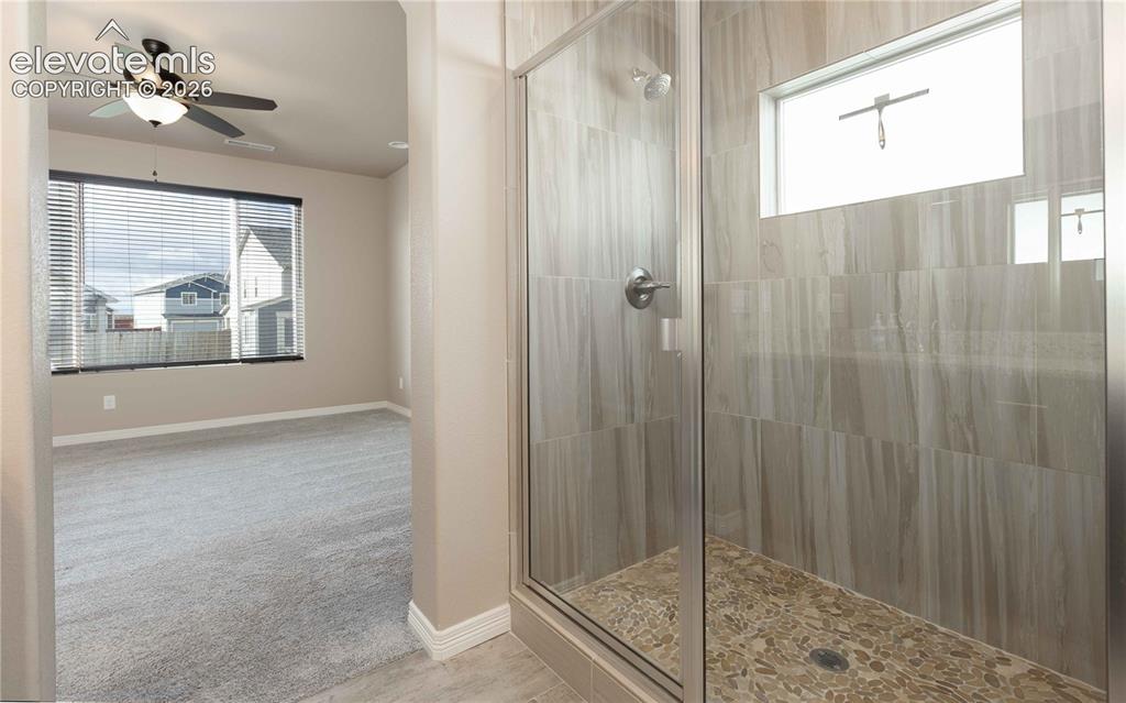 Image 22 of 40: Dual shower heads in shower stall 