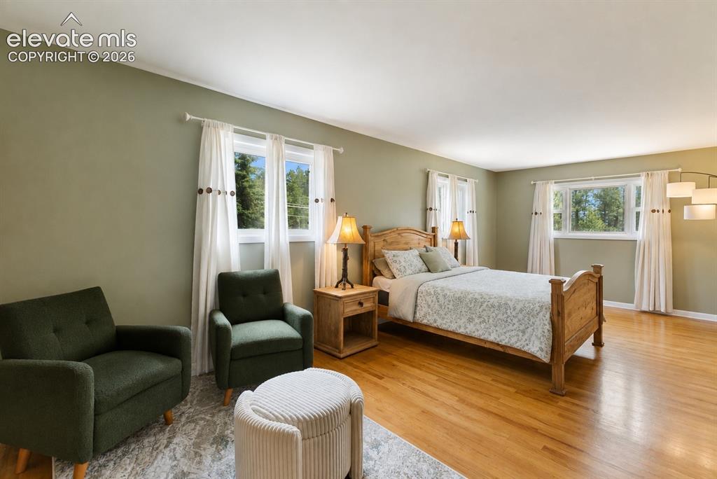 Image 13 of 32: Primary Bedroom with sitting area