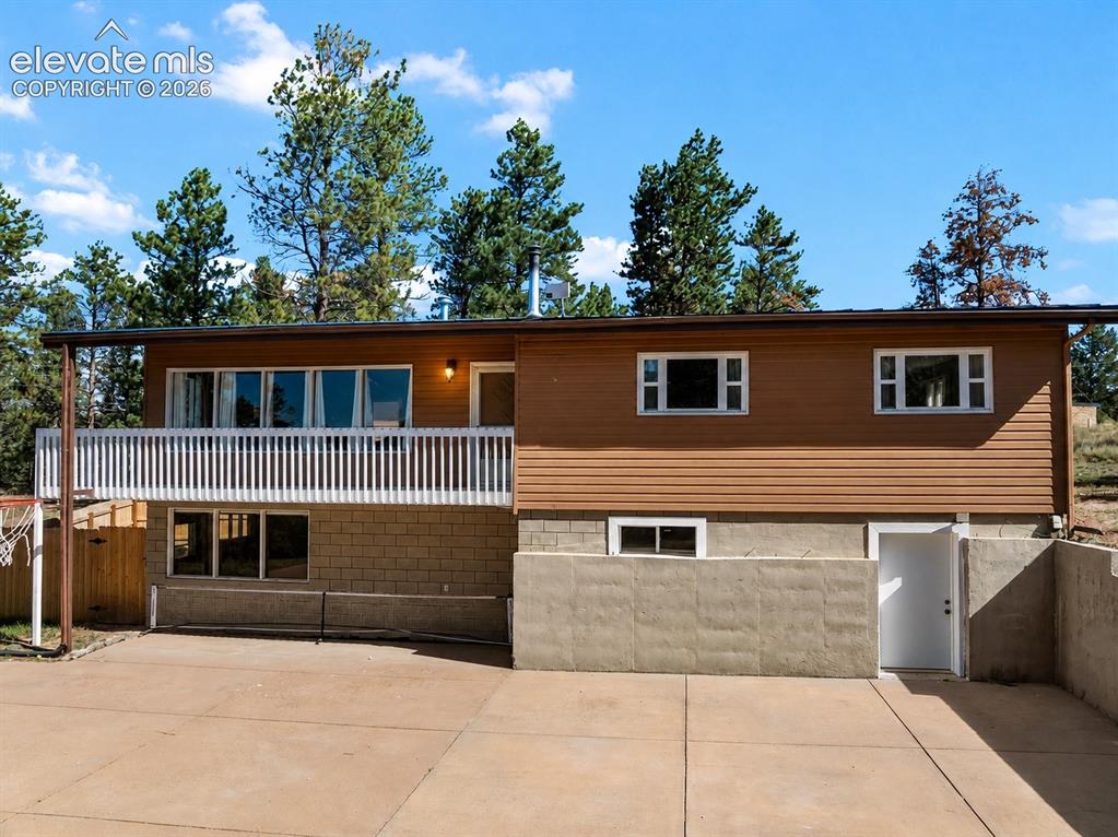 Image 24 of 32: Back of house and patio