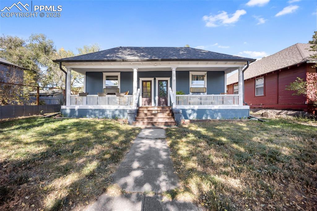 Caption: Adorable Bungalow-style home - covered front porch to enjoy!