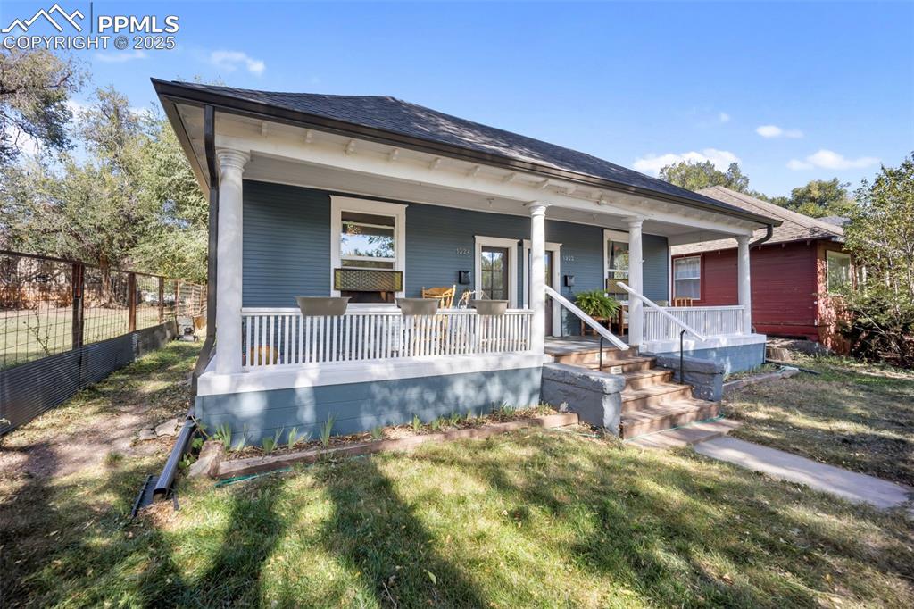 Image 3 of 41: View of front of house with covered porch and a shingled roof