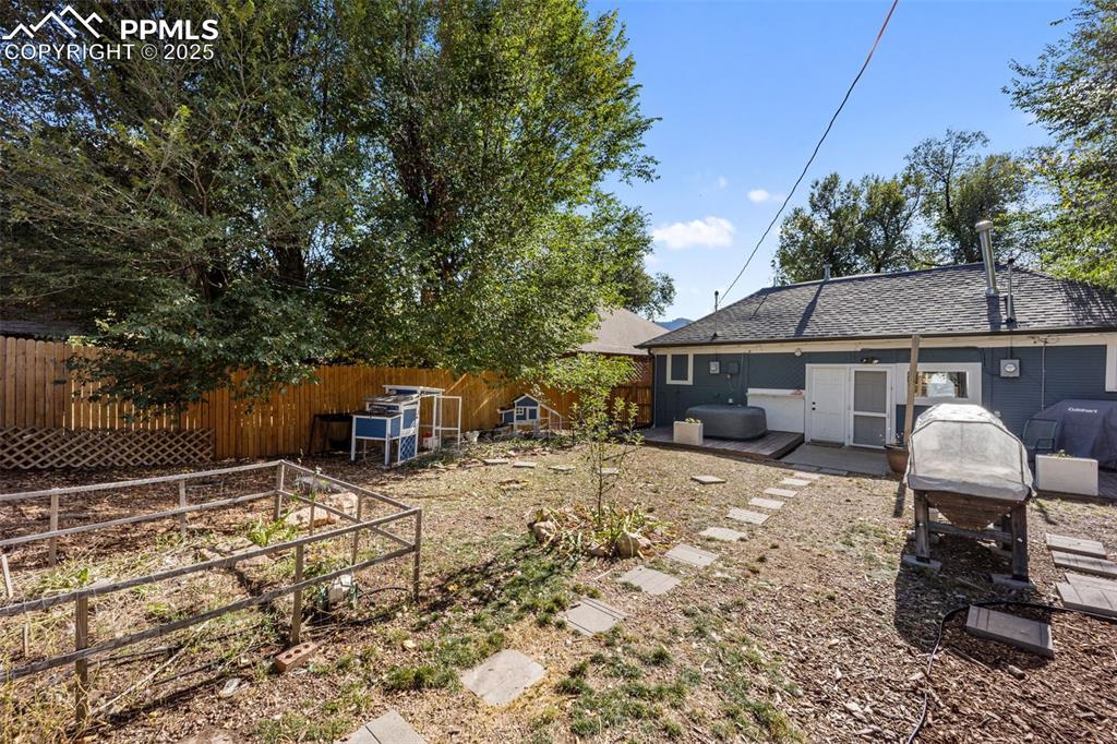 Image 31 of 41: View of fenced backyard