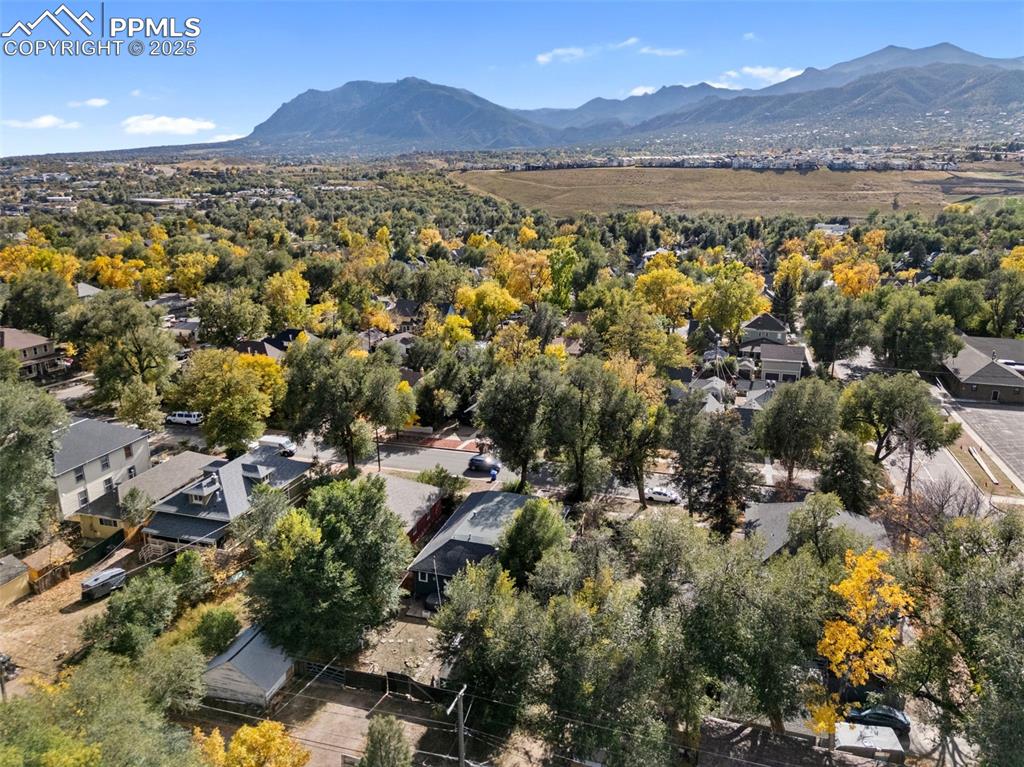 Image 40 of 41: View of property location with a mountainous background and nearby suburban