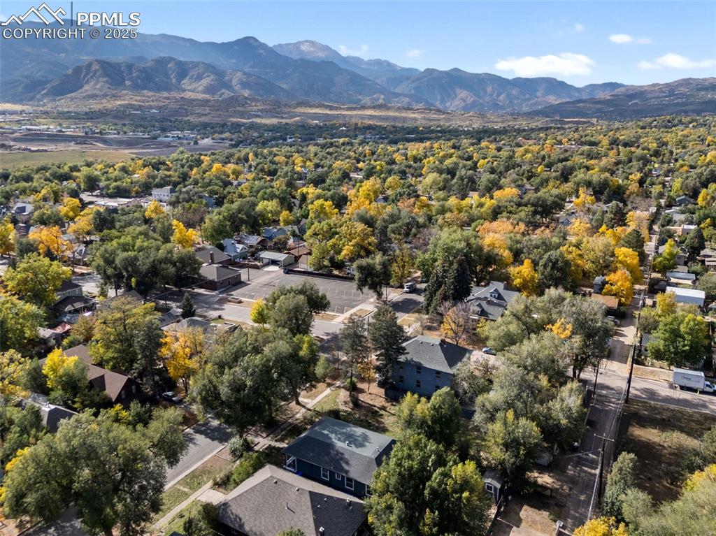 Image 41 of 41: Aerial perspective of suburban area with a mountainous background