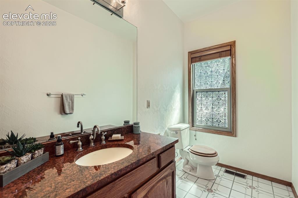 Image 18 of 49: Half-Bath on Main Level with Generous Closet