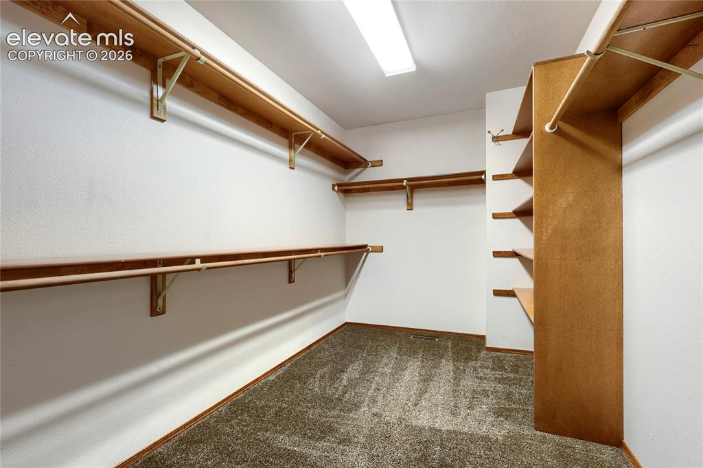 Image 24 of 49: Spacious Walk-In Closet