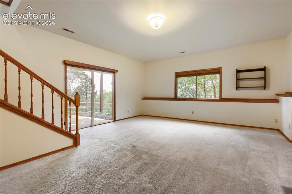 Image 32 of 49: Complete with Walk-Out Access - Tons of Natural Light