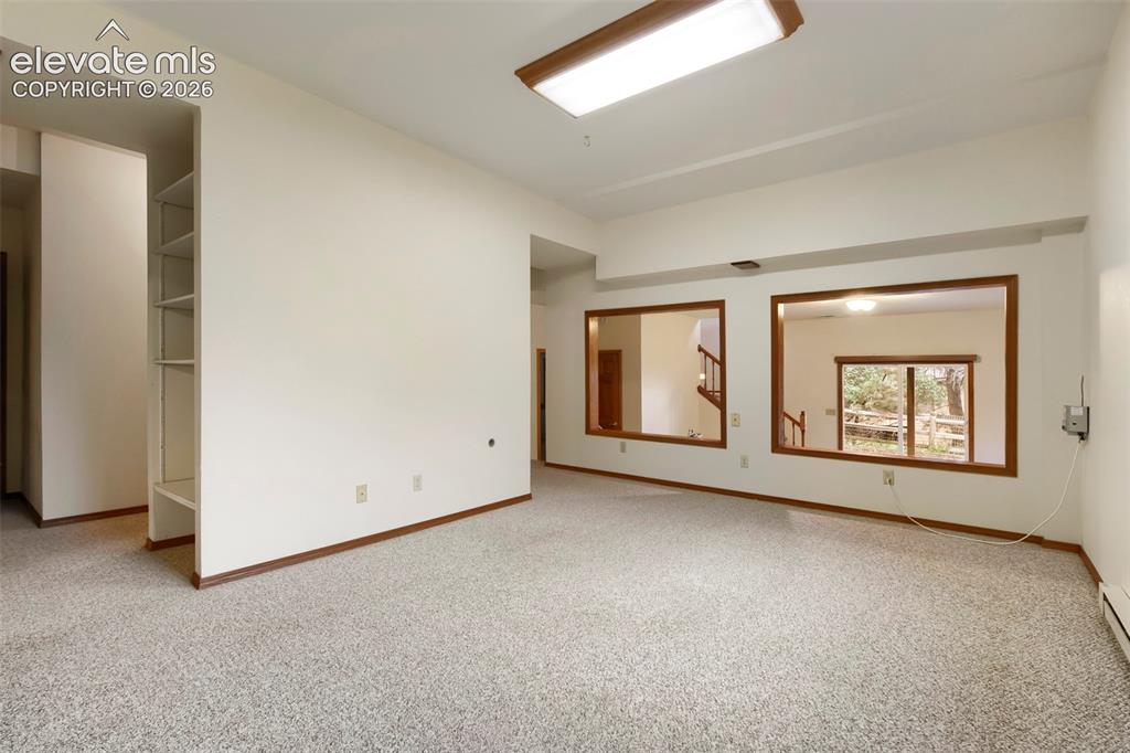 Image 34 of 49: Additional Bonus Play/Work Room on Lower Level