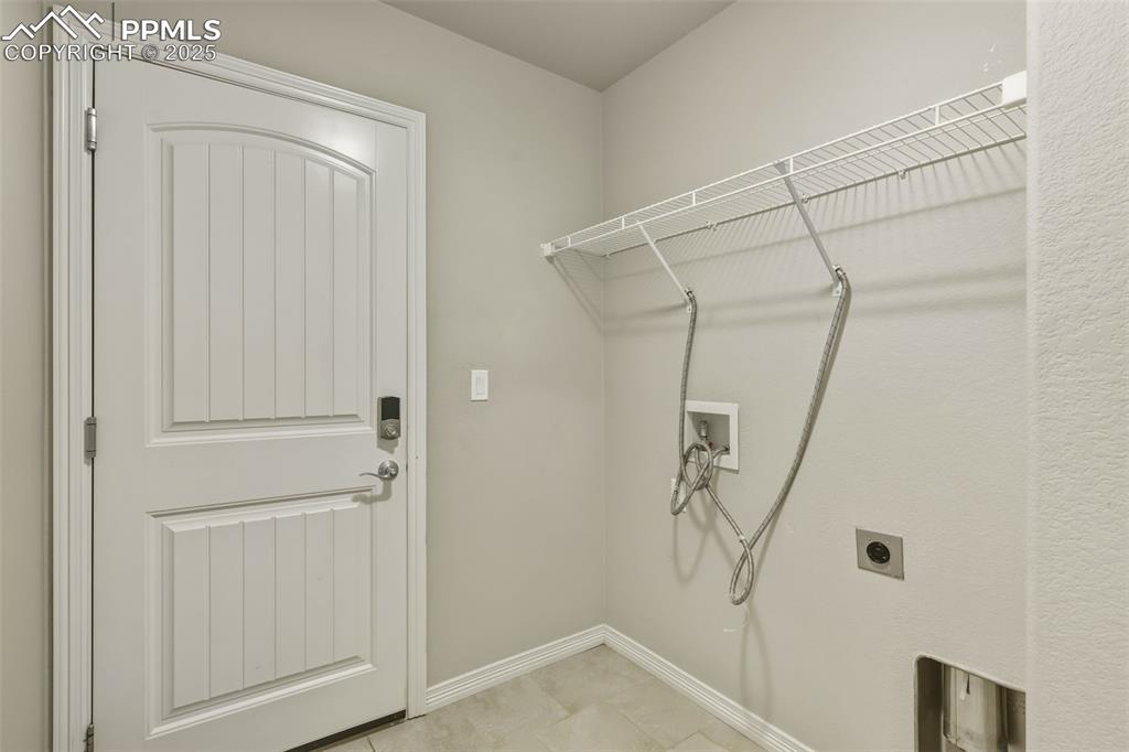 Image 10 of 27: Laundry room featuring hookup for a washing machine, hookup for an electric
