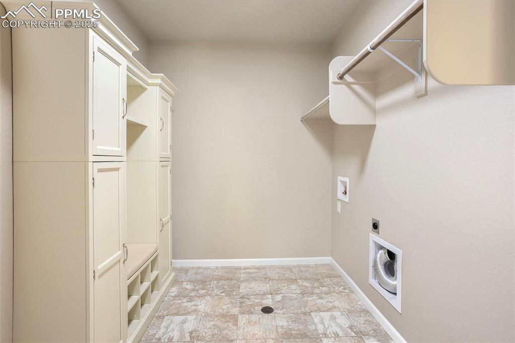 Image 17 of 48: Laundry area featuring hookup for an electric dryer and washer hookup