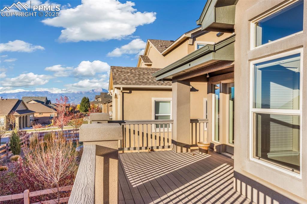 Image 43 of 48: Wooden deck with a residential view and a mountain view