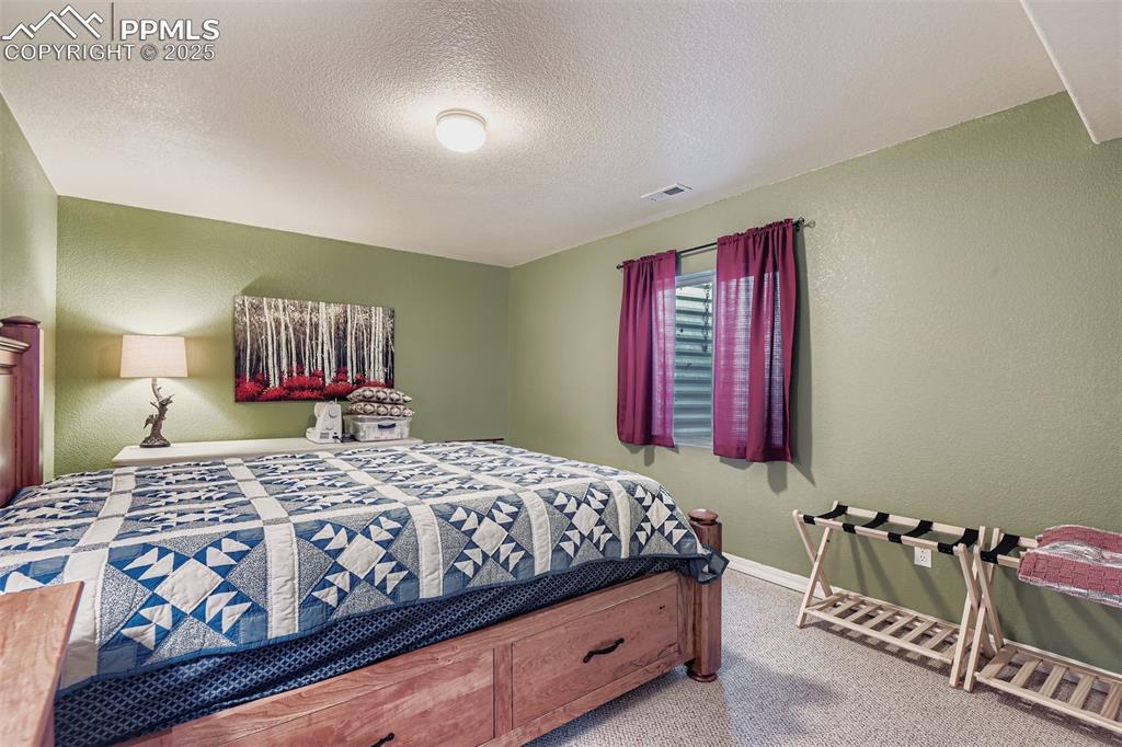 Image 24 of 29: Bedroom in basement