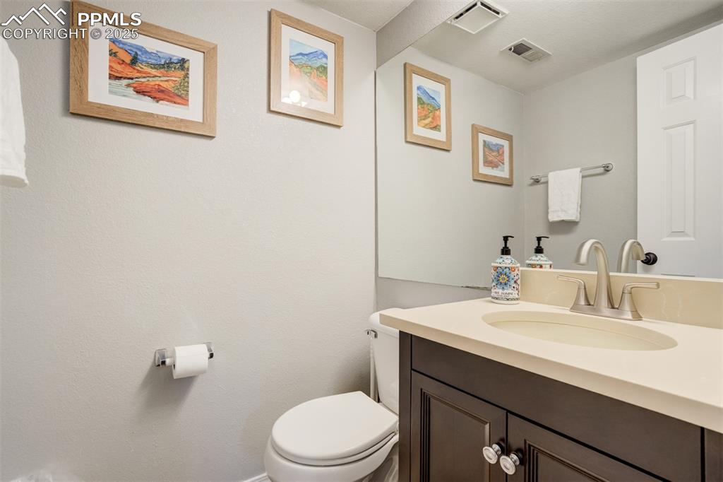 Image 29 of 36: Bathroom with vanity and toilet