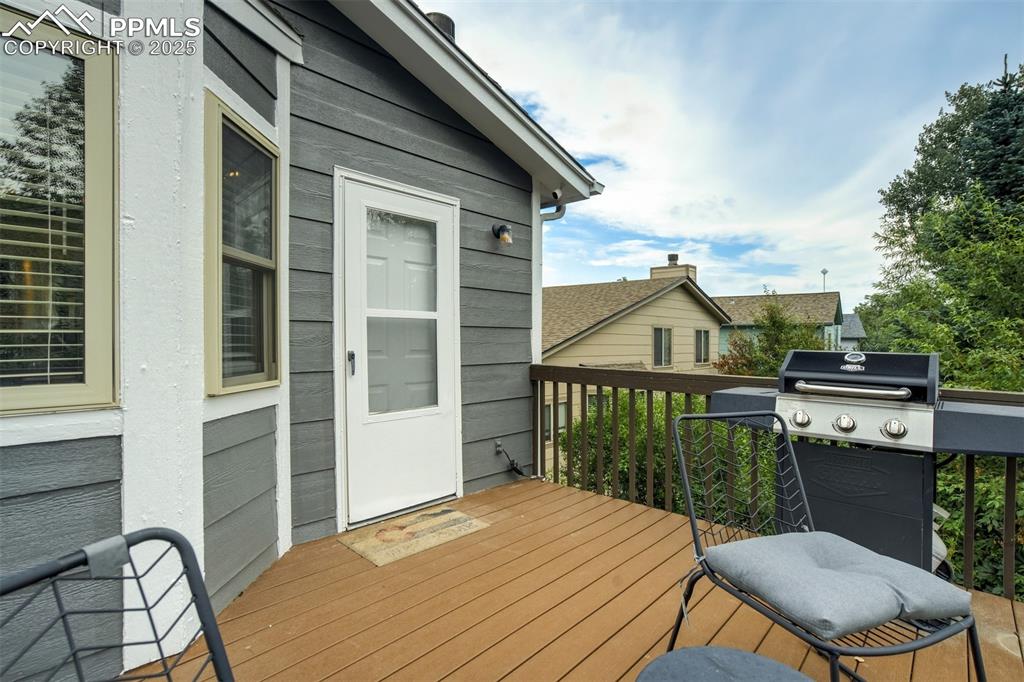 Image 30 of 36: Wooden deck featuring grilling area