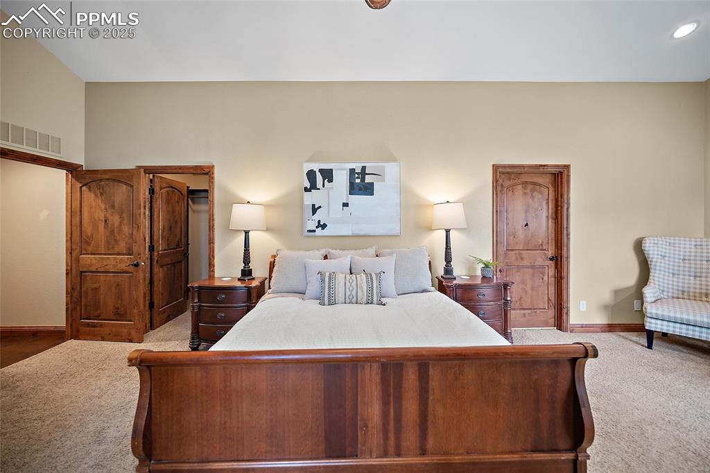 Image 17 of 47: Bedroom with carpet and baseboards