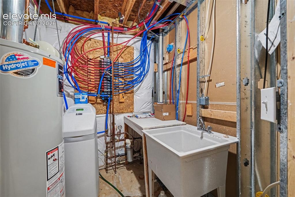 Image 26 of 33: Basement Utility Room (Furnace, Water Heater, Sink and Water Softener)