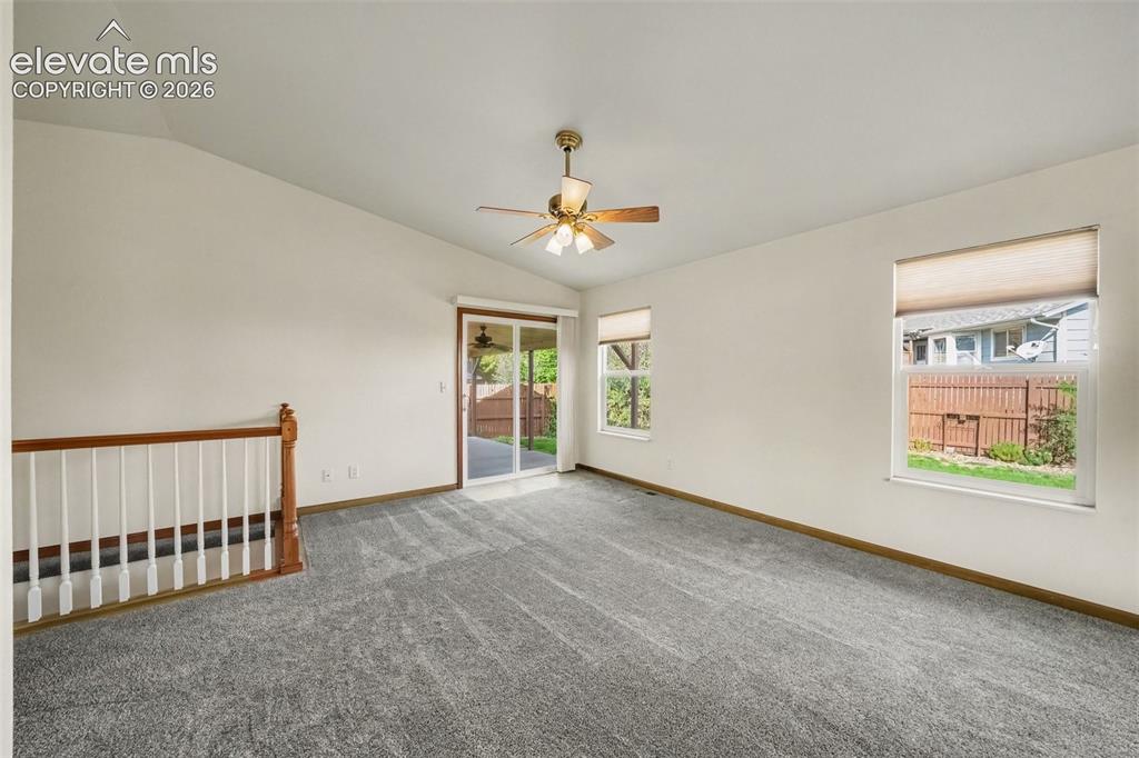 Image 5 of 33: Living Room Facing Walkout To Patio