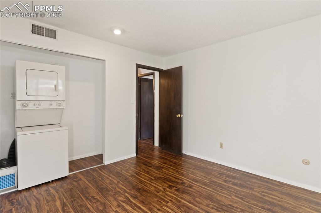 Image 14 of 20: Second bedroom with laundry hook ups could be used as office, storage, or r