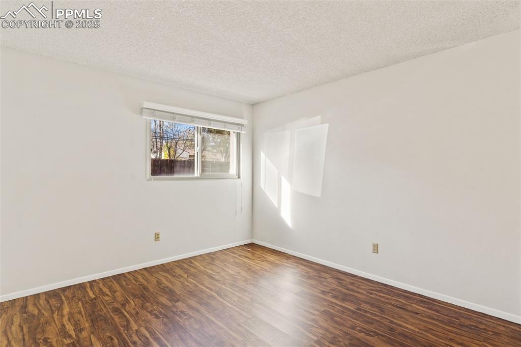 Image 15 of 20: Bedrooms with LVP, window coverings, and new windows