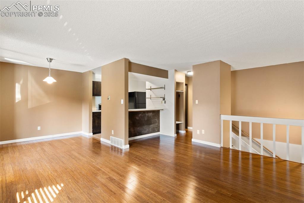 Image 9 of 20: Lots of open space and light in the open concept living on the upper level