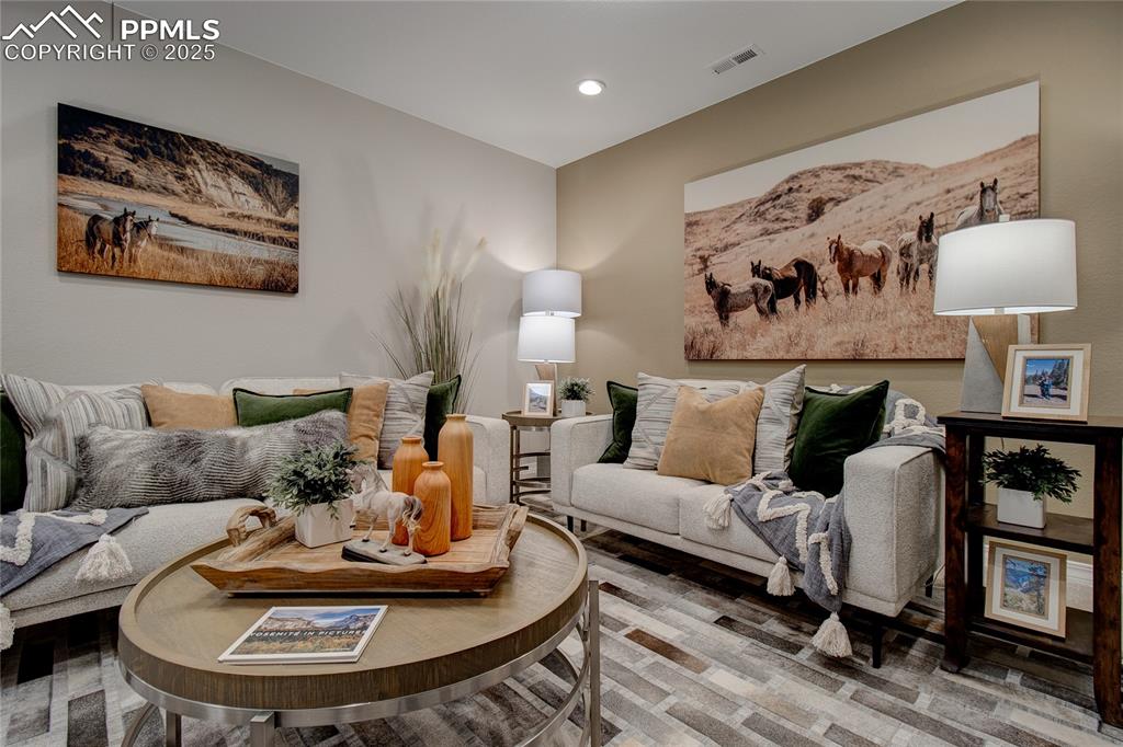 Image 14 of 32: Living area featuring recessed lighting and wood finished floors