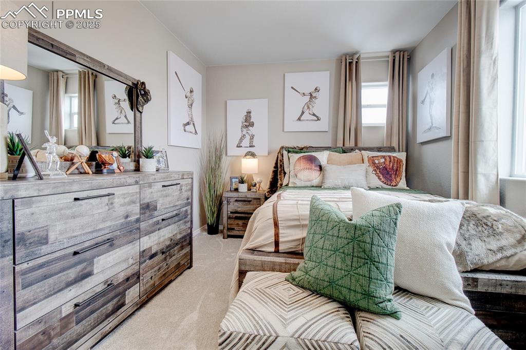 Image 19 of 32: Bedroom featuring light carpet