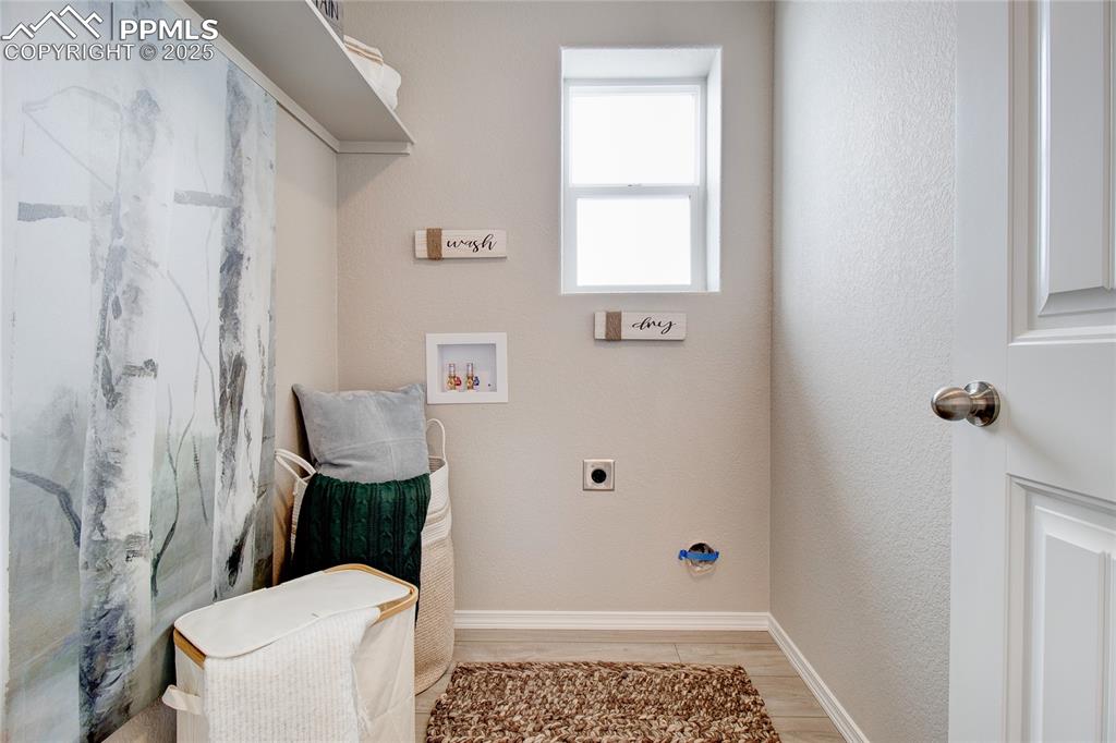 Image 21 of 32: Laundry room featuring hookup for a washing machine and hookup for an elect
