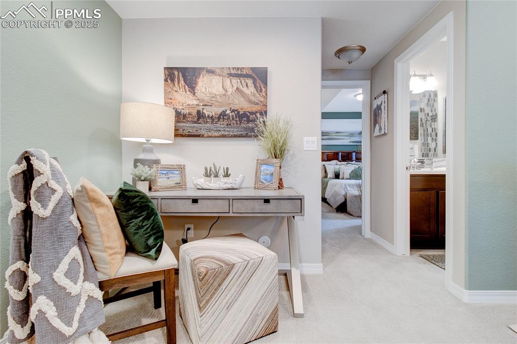 Image 29 of 32: Hall featuring carpet and baseboards