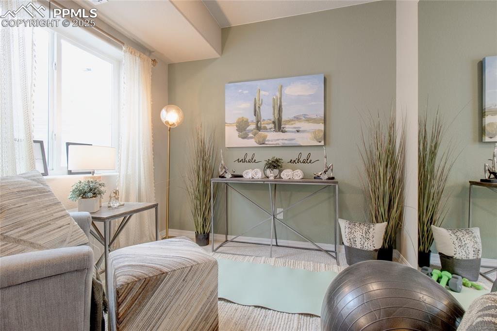 Image 32 of 32: Living room with baseboards