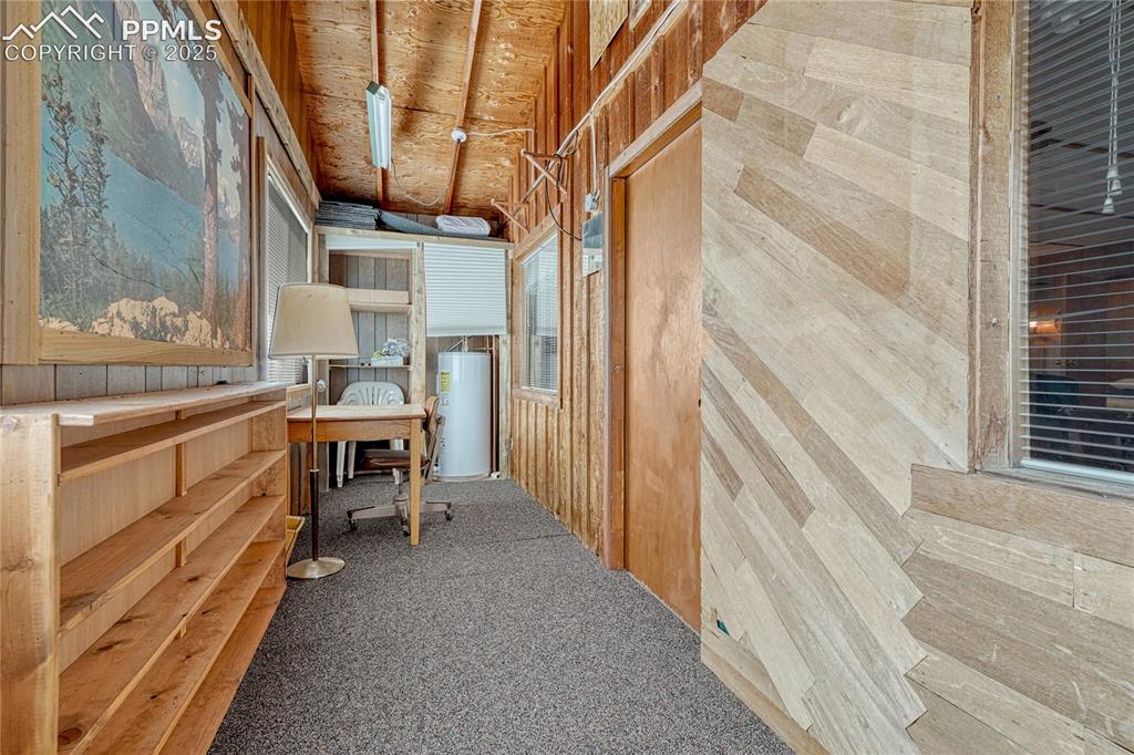 Image 19 of 41: sun room where waterheater is