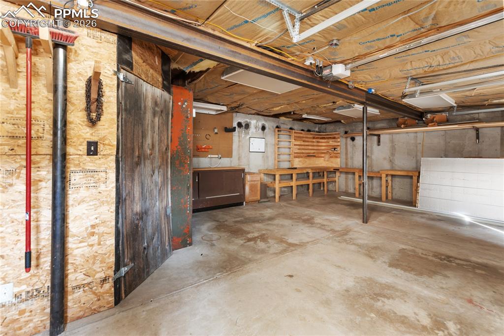 Image 29 of 46: Oversized 2 Car Garage, Workspace, Storage!