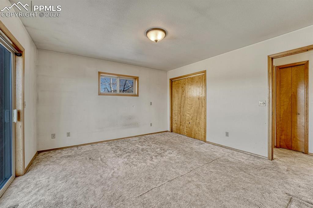 Image 32 of 50: (Main Level) Primary bedroom.