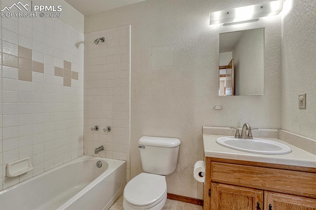 Image 34 of 50: Main level full bathroom.