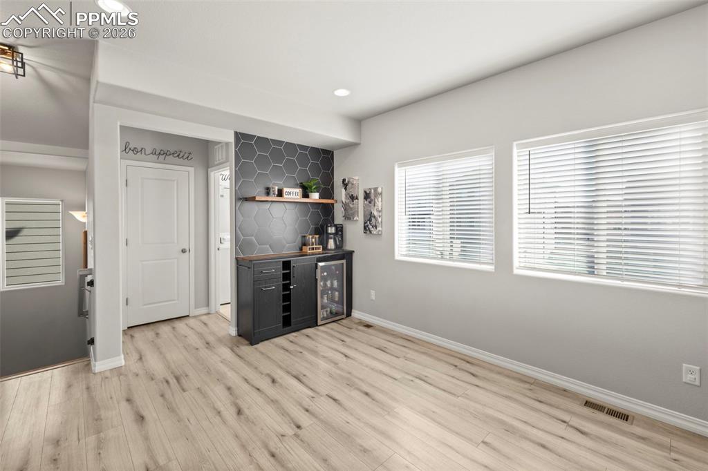 Image 15 of 50: Custom coffee/mini bar in the kitchen