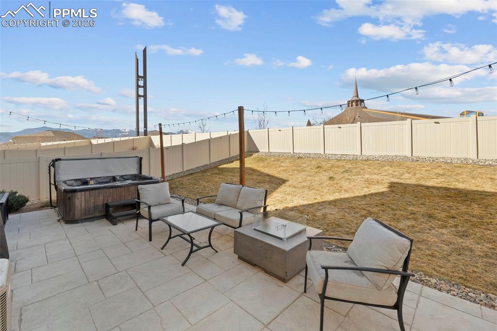 Image 32 of 50: Custom concrete natural gas firepit professionally installed