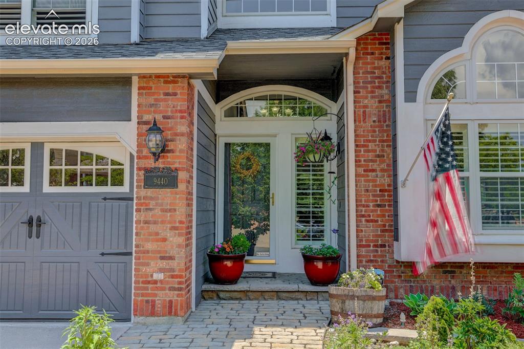 Image 2 of 49: Entryway featuring a decorative arched glass door with transom window, flan